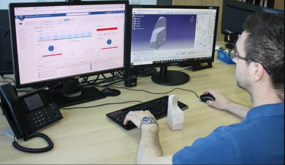 Engineer designing a part with CAD software